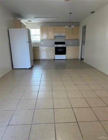 a kitchen with a cabinets and window