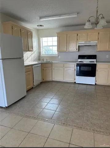 a kitchen with stainless steel appliances a cabinets and a counter top space