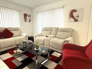 a living room with furniture and a window