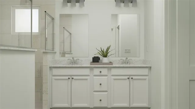 a bathroom with a sink vanity granite and a mirror