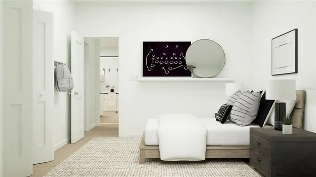 a bedroom with a bed and cabinet