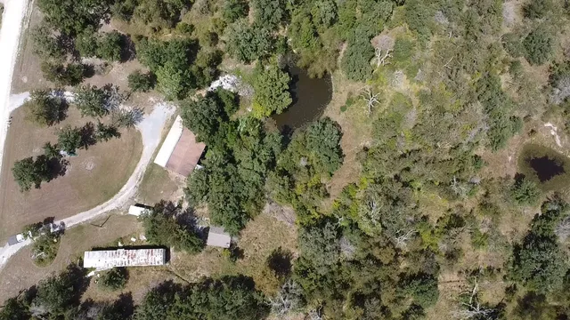 an aerial view of residential house with outdoor space