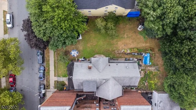an aerial view of a house with outdoor space