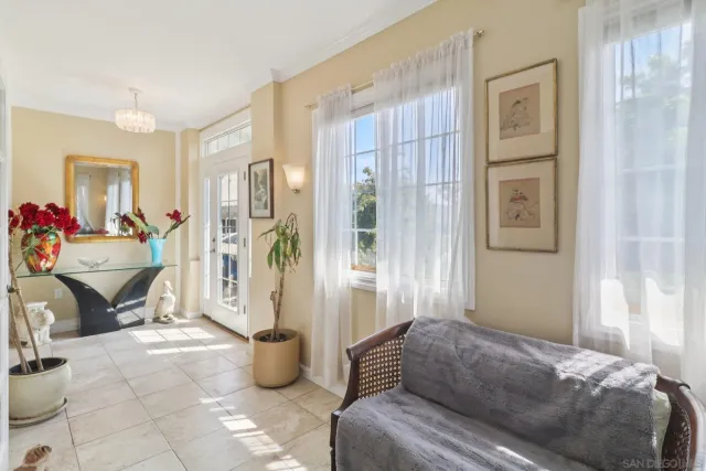 a bedroom with furniture and a potted plant