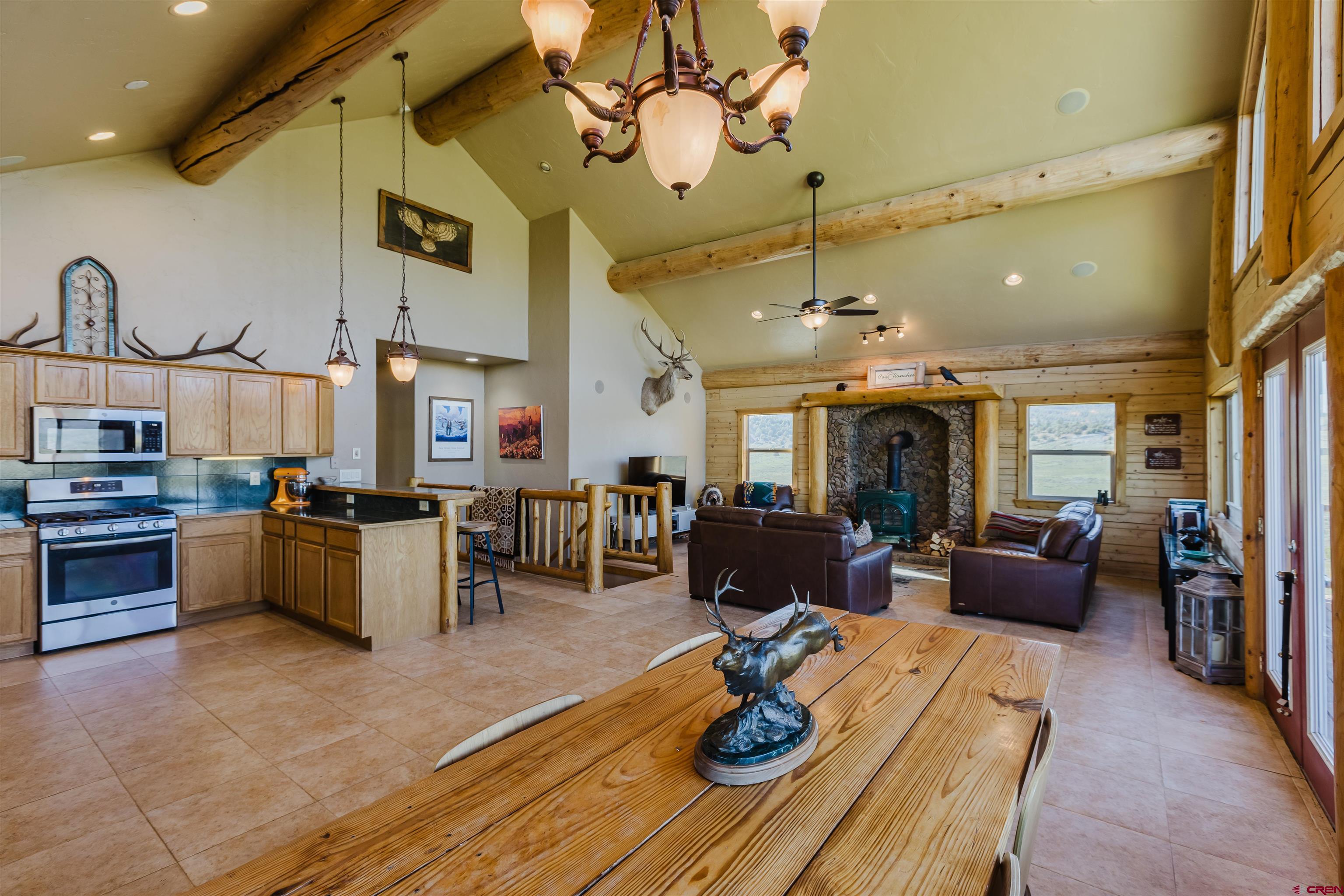 2439 County Road 359 Pagosa Springs, CO 81147 - Photo 12 of 45 a living room with furniture kitchen view and a large window