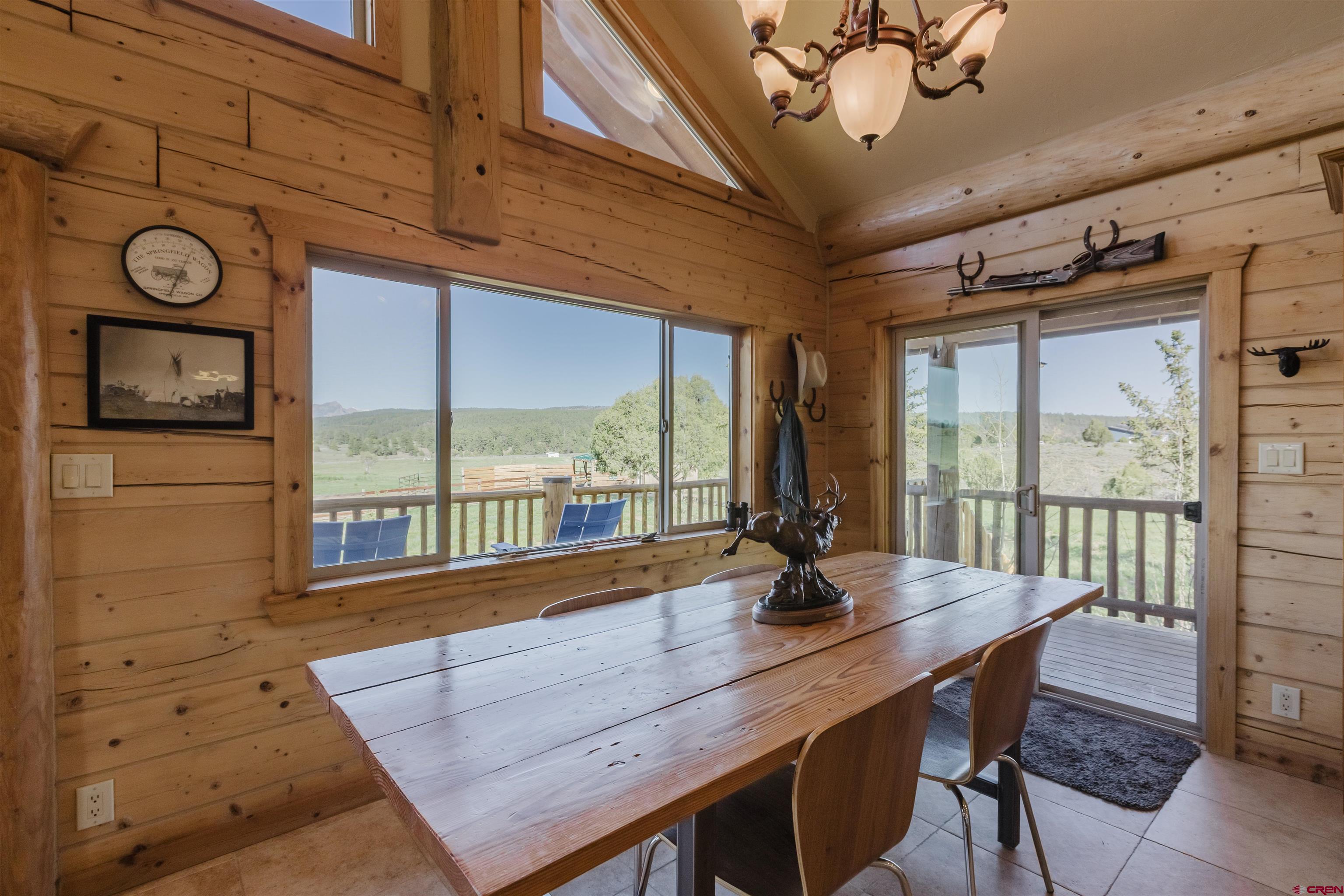 2439 County Road 359 Pagosa Springs, CO 81147 - Photo 18 of 45 a view of a dining room with furniture window and outside view