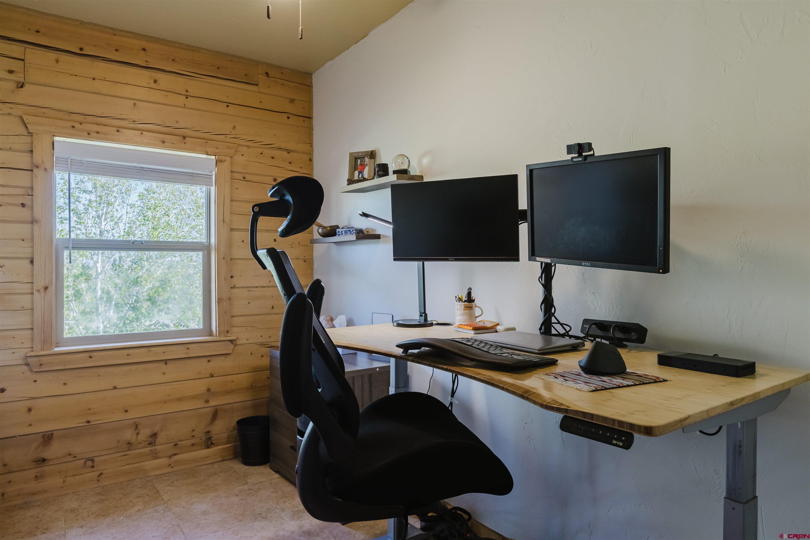 2439 County Road 359 Pagosa Springs, CO 81147 - Photo 21 of 45 a view of a workspace with a window and furniture