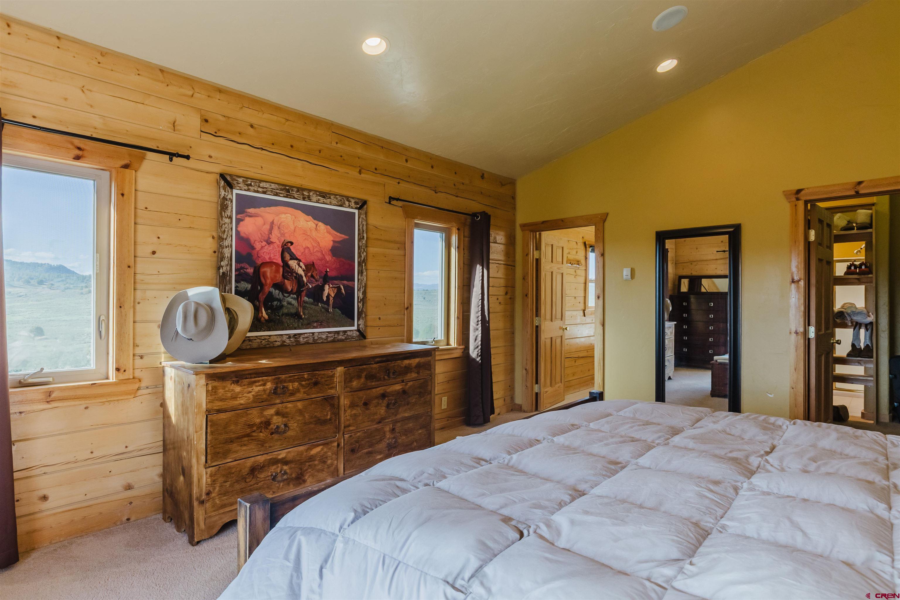 2439 County Road 359 Pagosa Springs, CO 81147 - Photo 24 of 45 a bedroom with a bed and a dresser