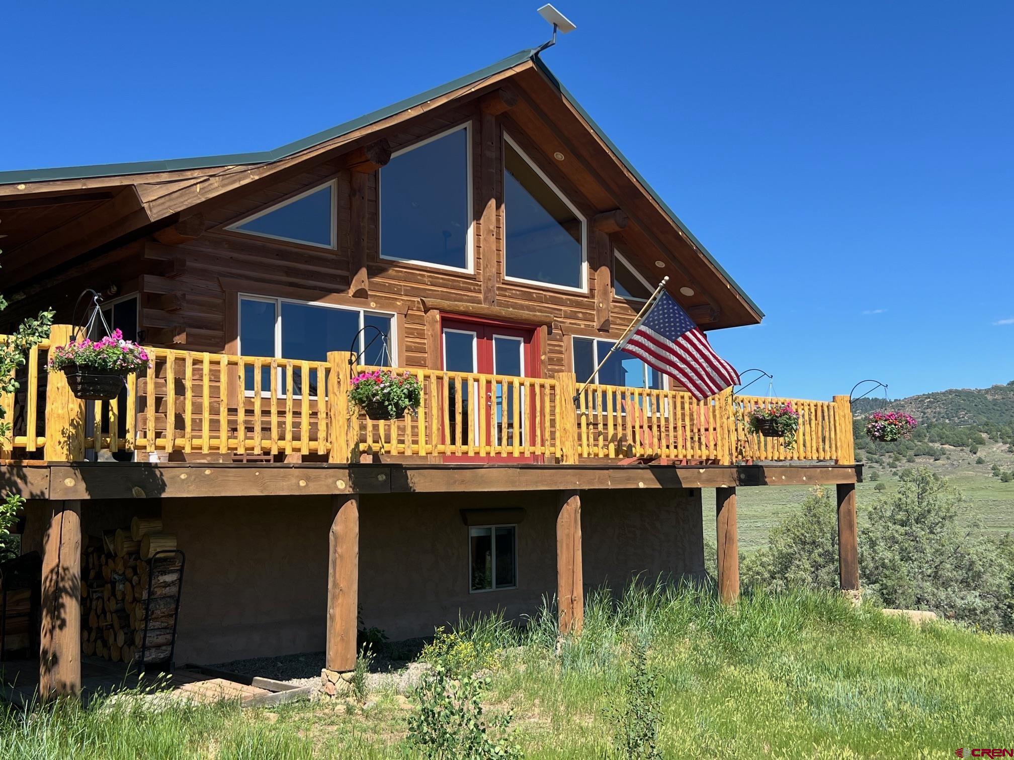 2439 County Road 359 Pagosa Springs, CO 81147 - Photo 3 of 45 a view of a house with large windows
