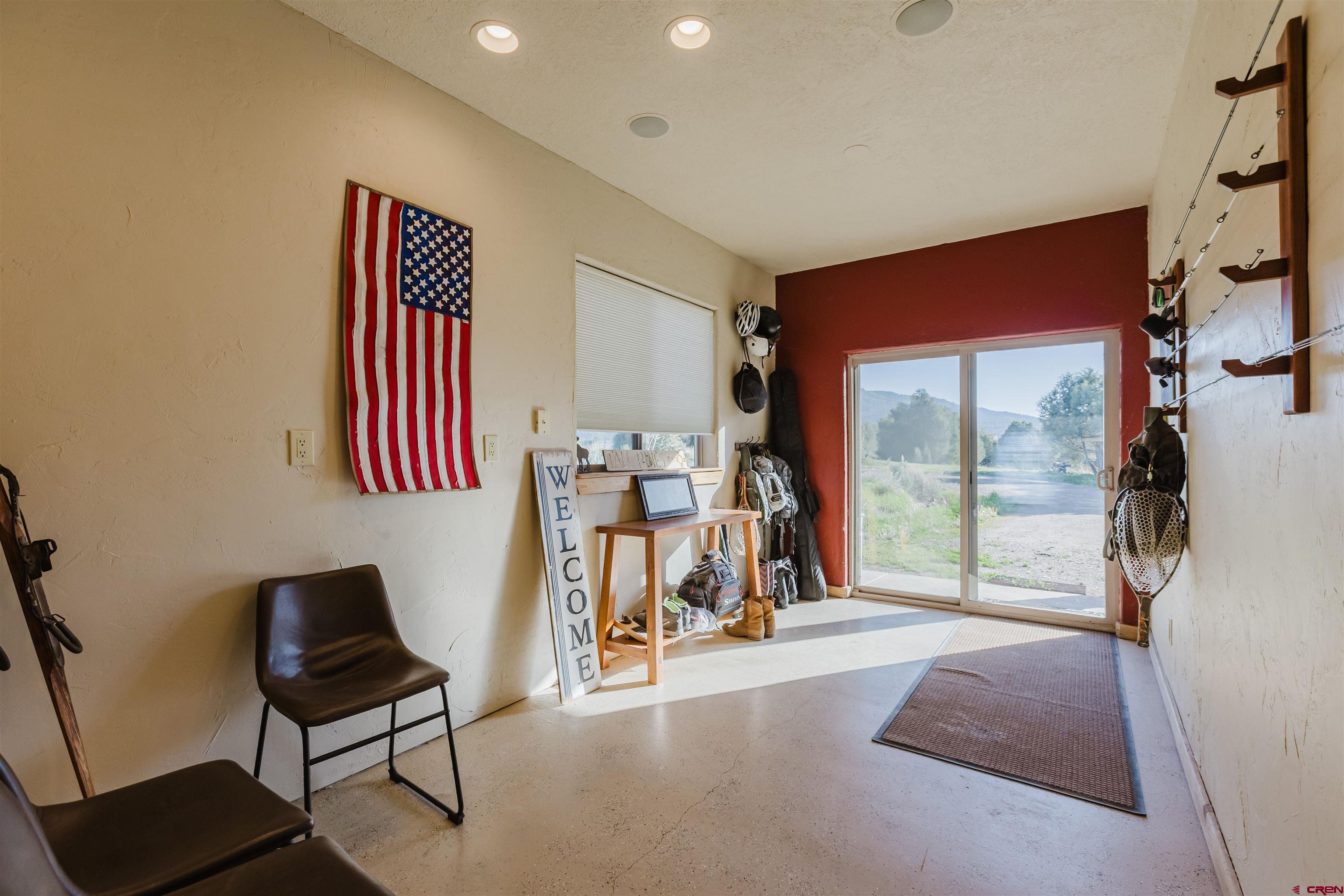 2439 County Road 359 Pagosa Springs, CO 81147 - Photo 42 of 45 a view of a livingroom with furniture and a gym cycle