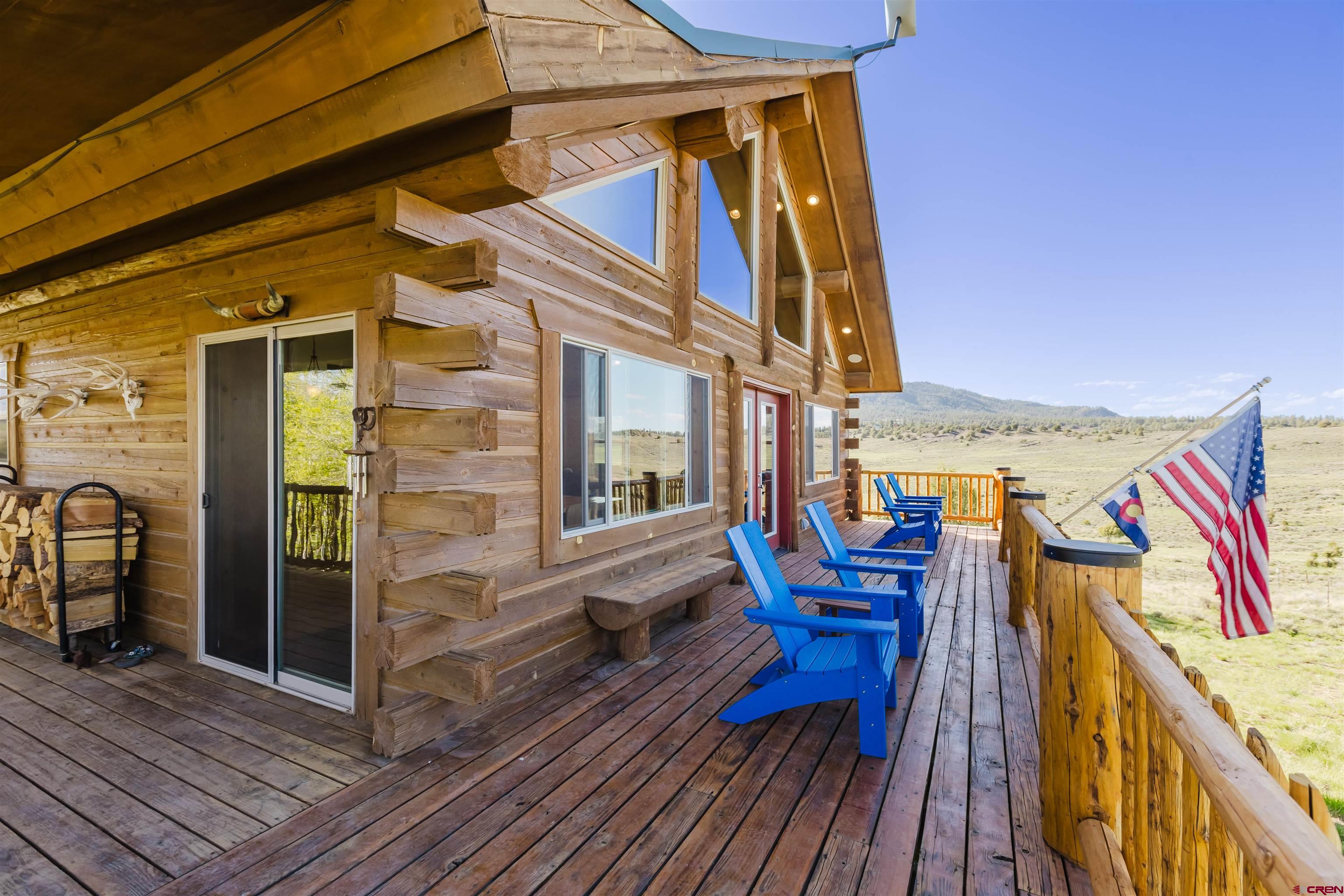2439 County Road 359 Pagosa Springs, CO 81147 - Photo 5 of 45 a view of a balcony with chairs