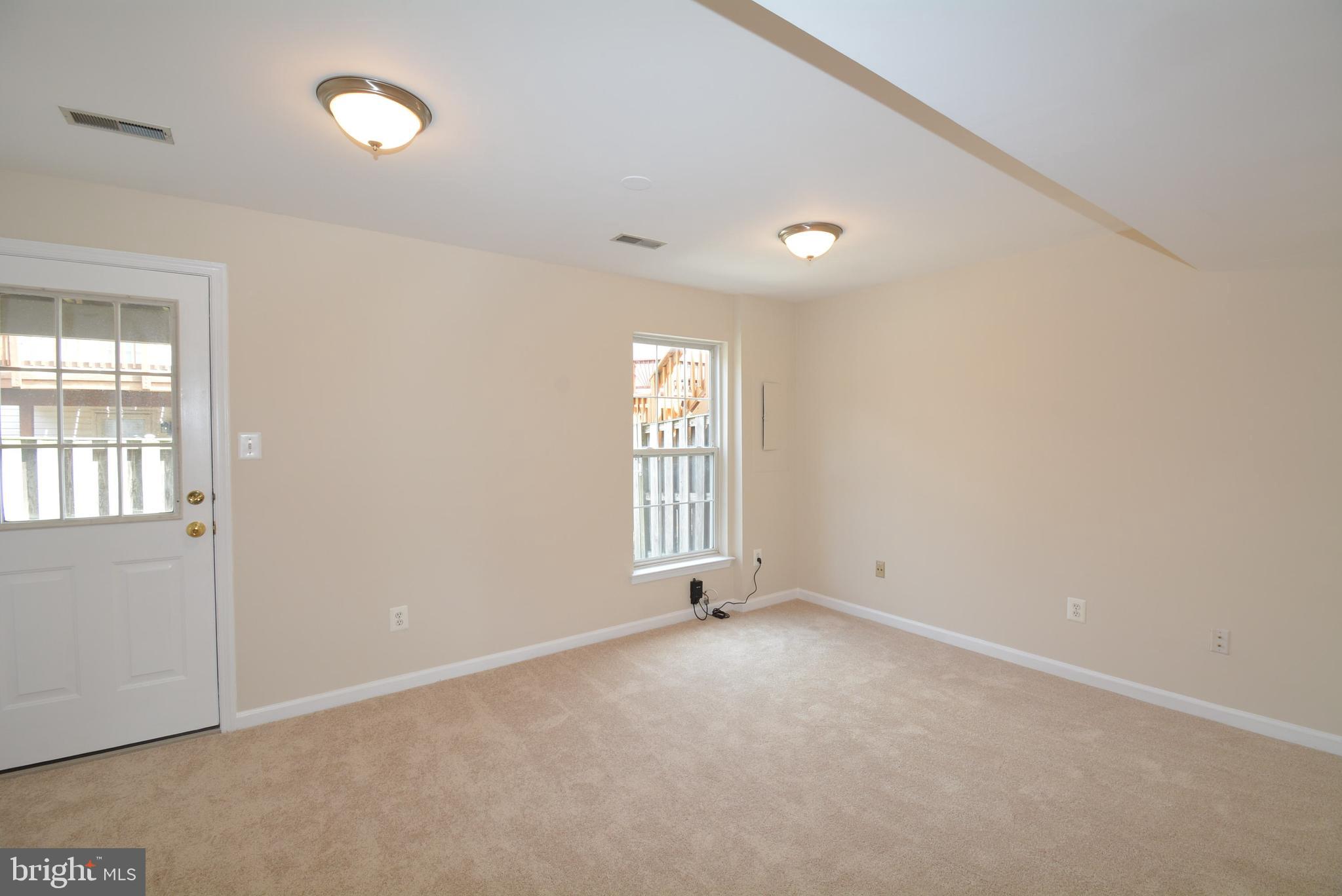 6494 Topsails Lane Springfield, VA 22150 - Photo 31 of 32 REC ROOM WITH WALKOUT TO FENCED YARD AND PATIO
