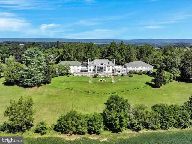 a view of a lake with houses in the background