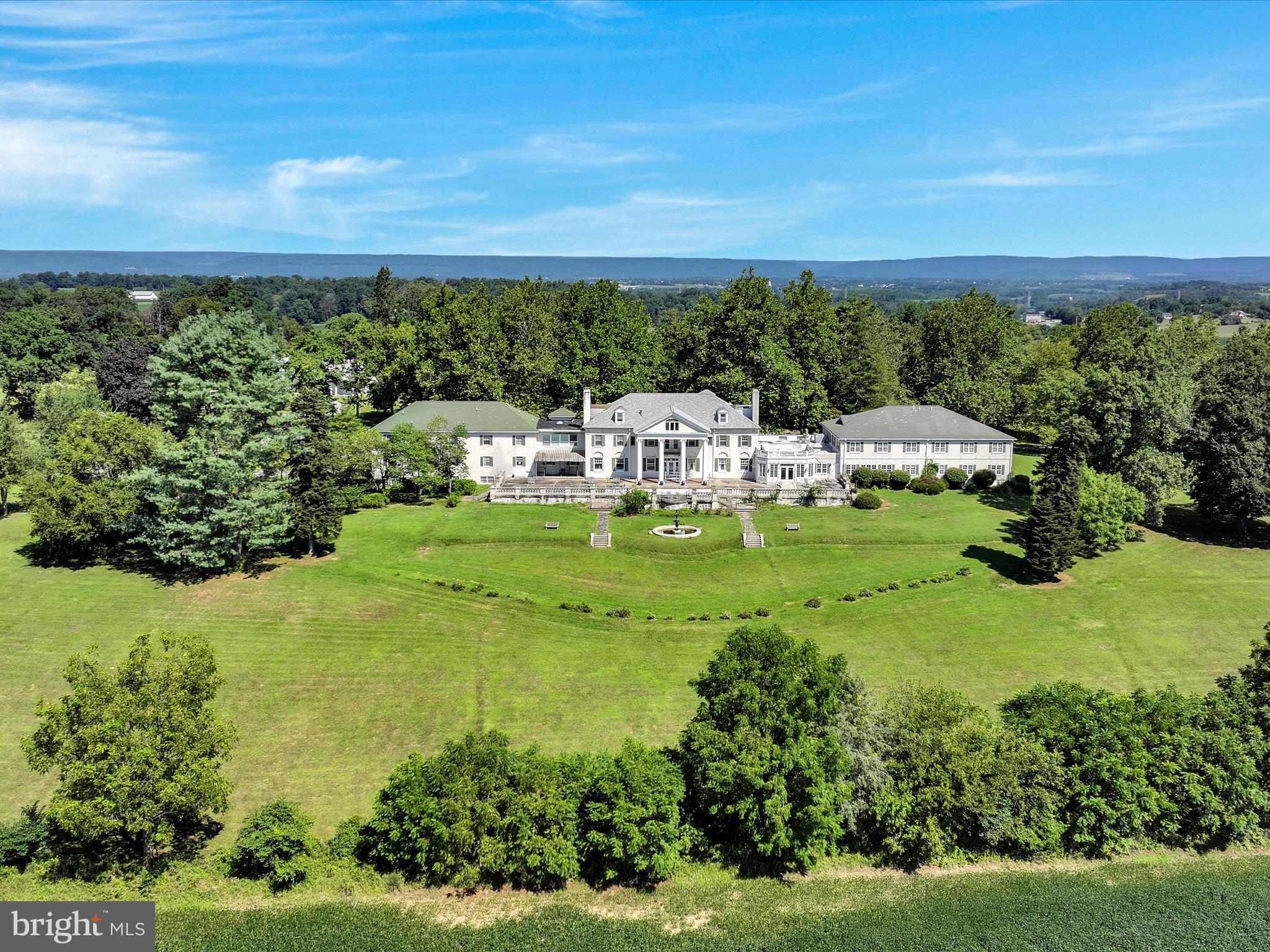 a view of a lake with houses in the background