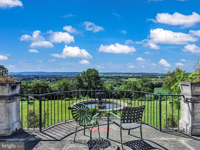 a kitchen with a stove and white cabinets