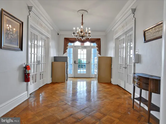 a bedroom with two beds and a window