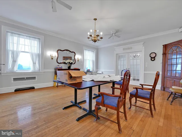 a spacious bedroom with a bed and a fireplace