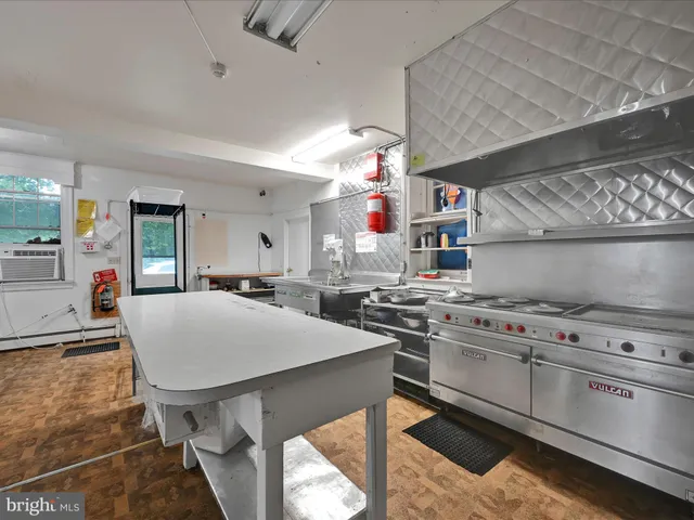 a bed room with a bed and a window