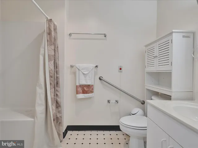 an aerial view of a golf course with a yard and lake view