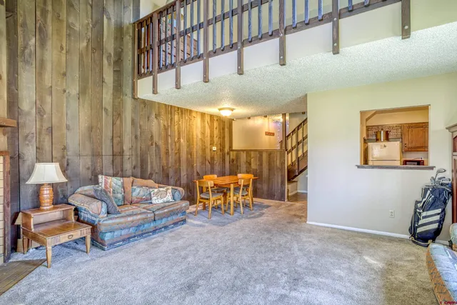 a living room with furniture and a table