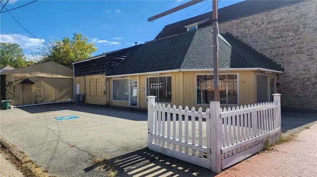a view of a house with a wooden deck