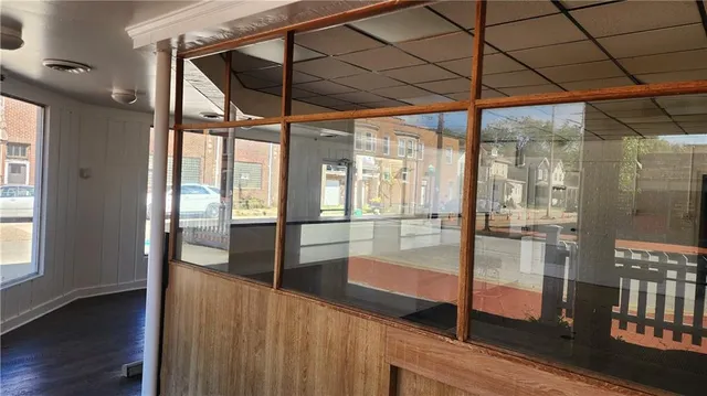 a view of a room with sliding door and wooden floor
