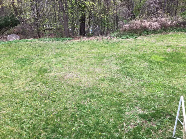 a fire hydrant in the middle of a field
