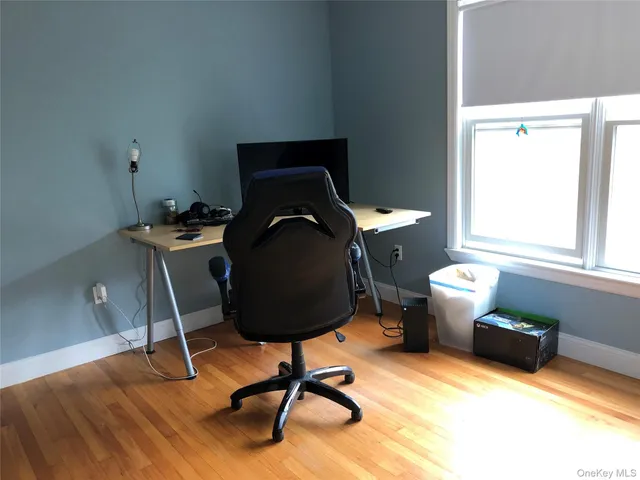 a workspace with furniture and a window