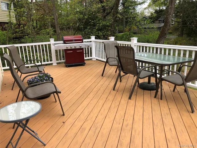 a view of a chairs and table on the deck