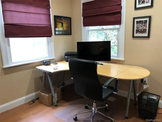 a view of a workspace with furniture