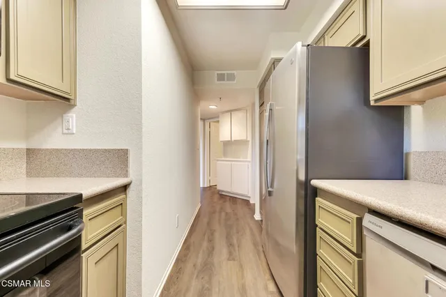 a view of hallway with wooden floor