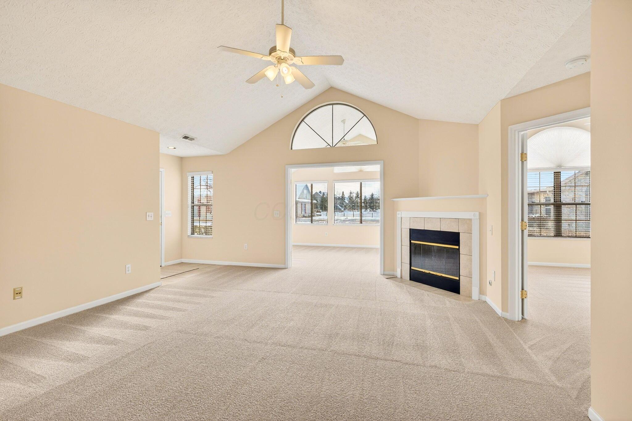 3731 Stoneway Point Powell, OH 43065 - Photo 8 of 47 New wall paint, new carpeting, cathedral ceilings, lighted ceiling fan & gas fireplace!