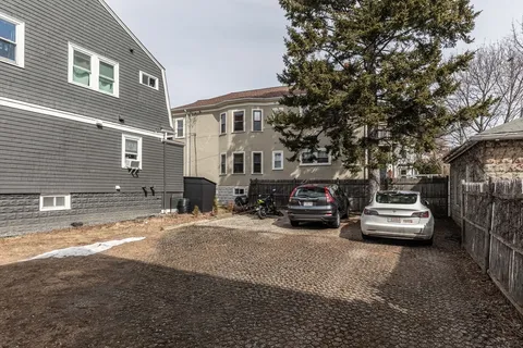 a front view of a house with parking