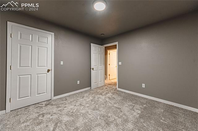 1027 County Road LL Fowler, CO 81039 - Photo 28 of 37 View of carpeted empty room
