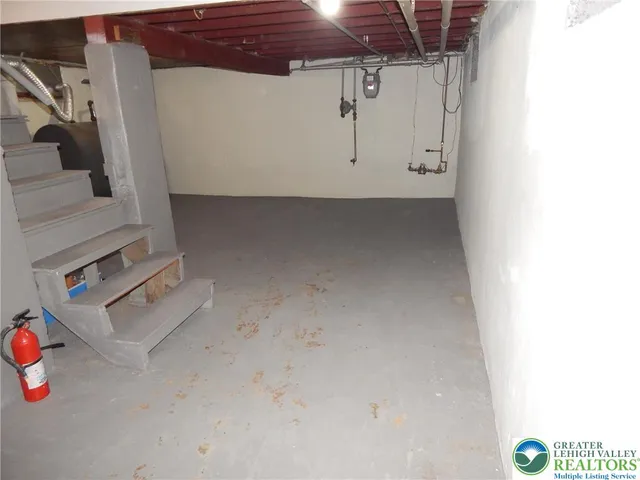 a view of storage and utility room with stairs