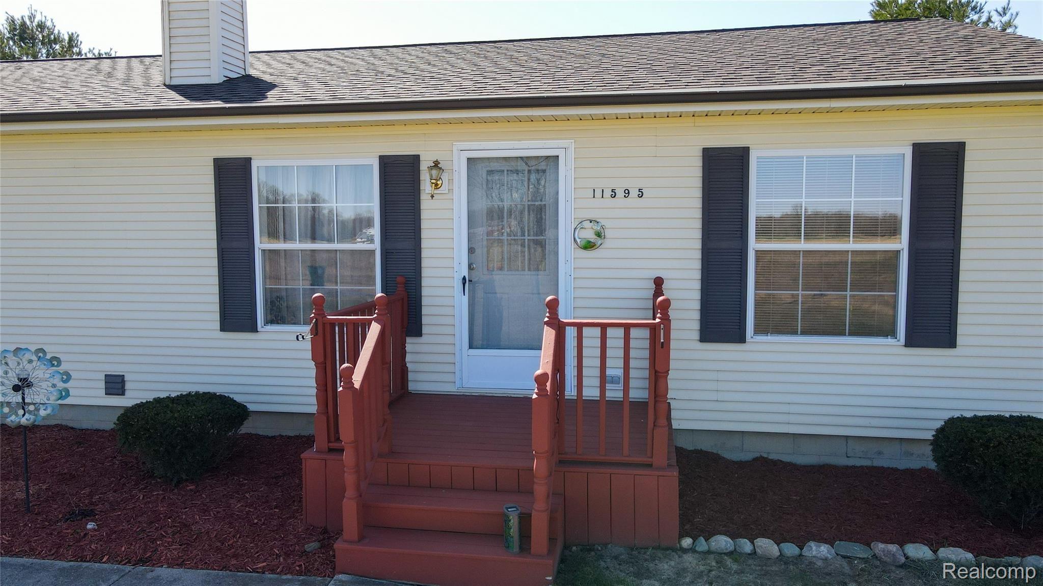 11595 West Sober Road Webberville, MI 48892 - Photo 3 of 42 11595 front porch - Copy.jpg
