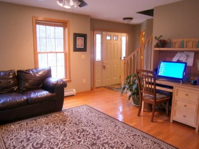 14 Gleason Farm Road Oakland, ME 04963 - Photo 15 of 32 Living room and front door. Stairs...