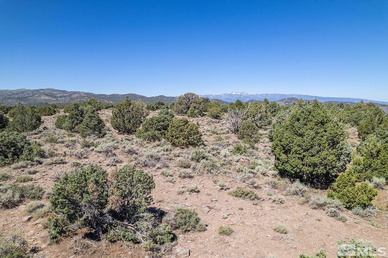4360 Rocky Road, Unit 436 Reno, NV 89521 - Photo 1 of 6 a view of a dry yard with mountains in the background