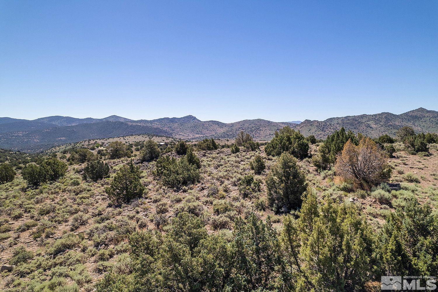 4360 Rocky Road, Unit 436 Reno, NV 89521 - Photo 3 of 6 a view of a lush green field with mountains in the background