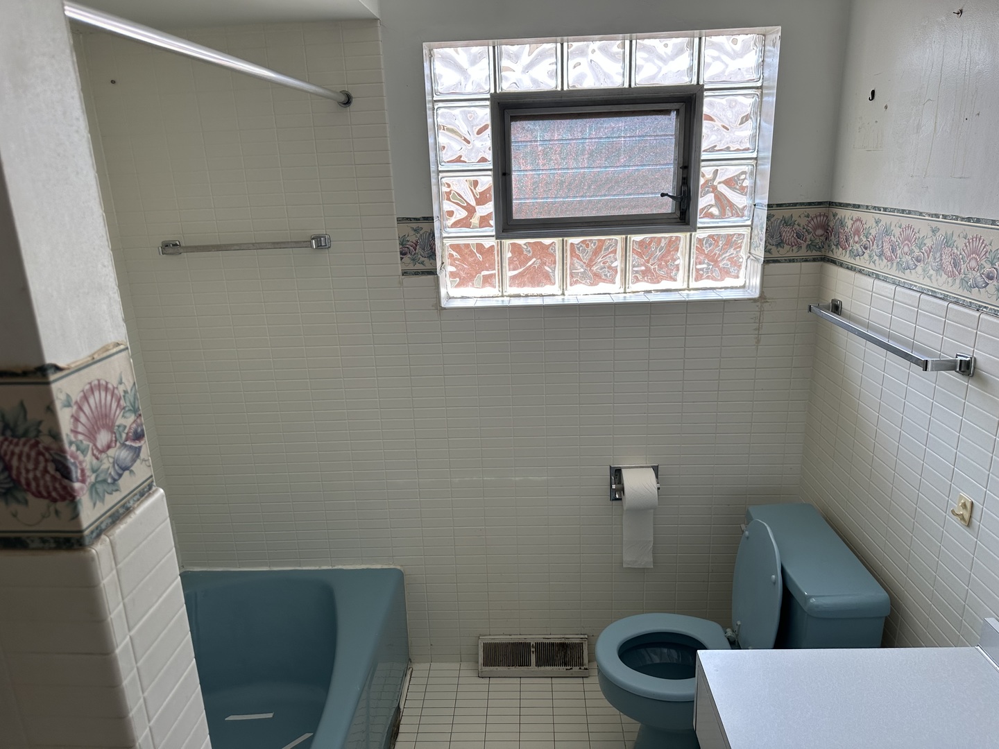 8517 South Kilbourn Avenue Chicago, IL 60652 - Photo 12 of 21 a bathroom with a toilet a sink and a window