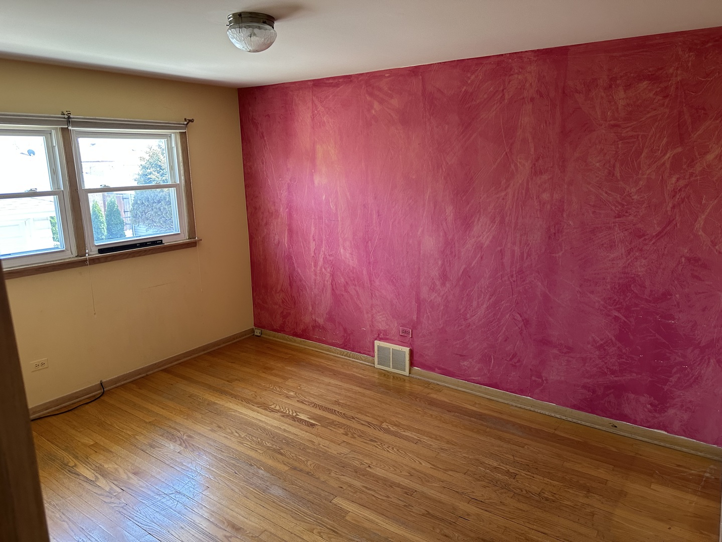 8517 South Kilbourn Avenue Chicago, IL 60652 - Photo 15 of 21 an empty room with wooden floor and windows
