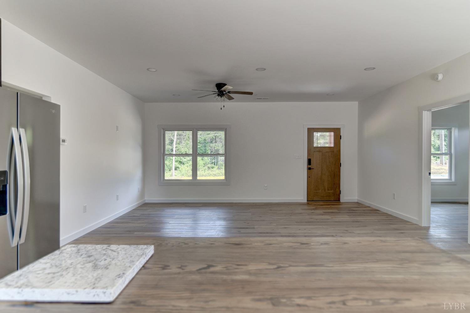 330 Bellview Road Appomattox, VA 24522 - Photo 14 of 26 an empty room with wooden floor and a window