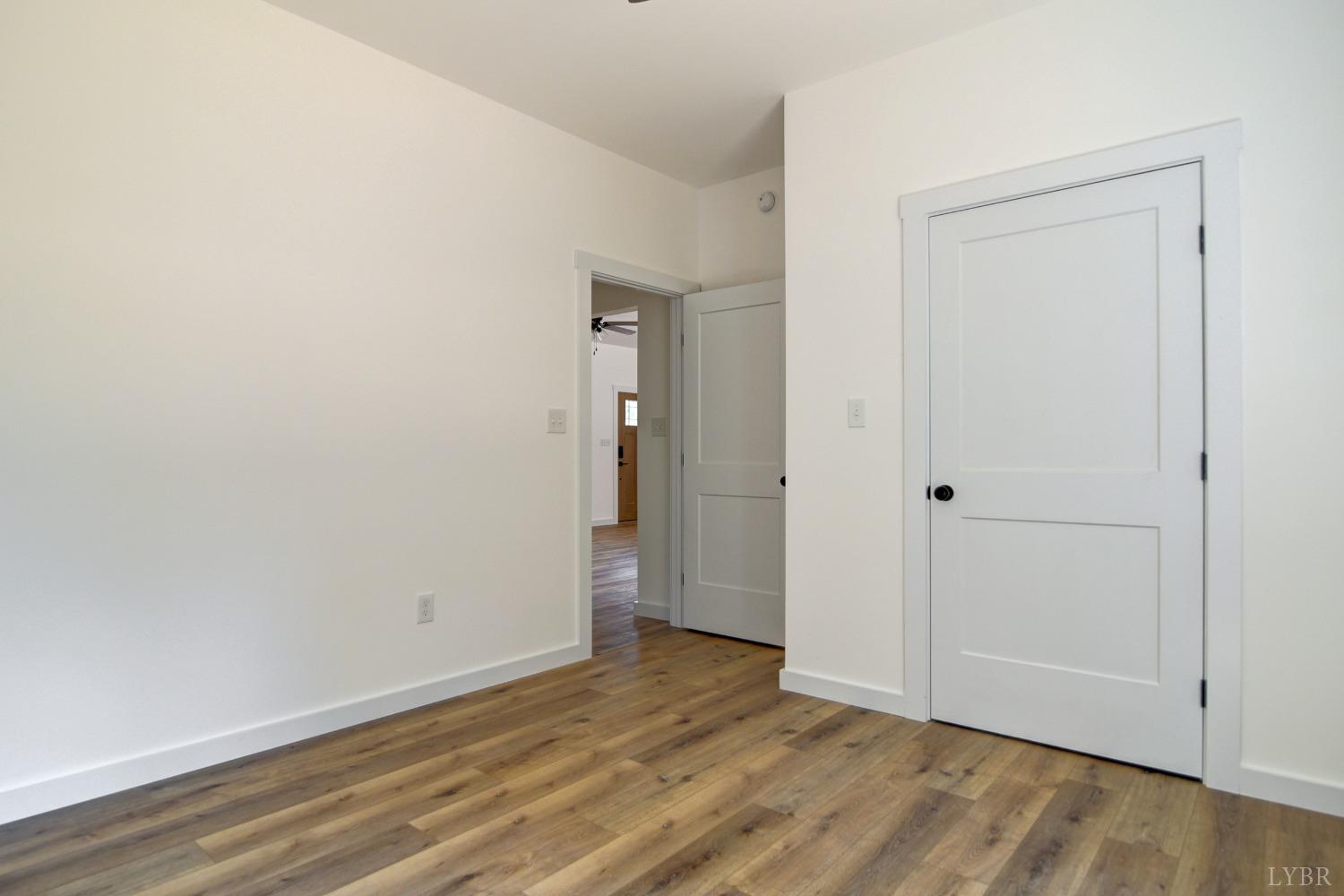 330 Bellview Road Appomattox, VA 24522 - Photo 21 of 26 a view of an empty room with wooden floor