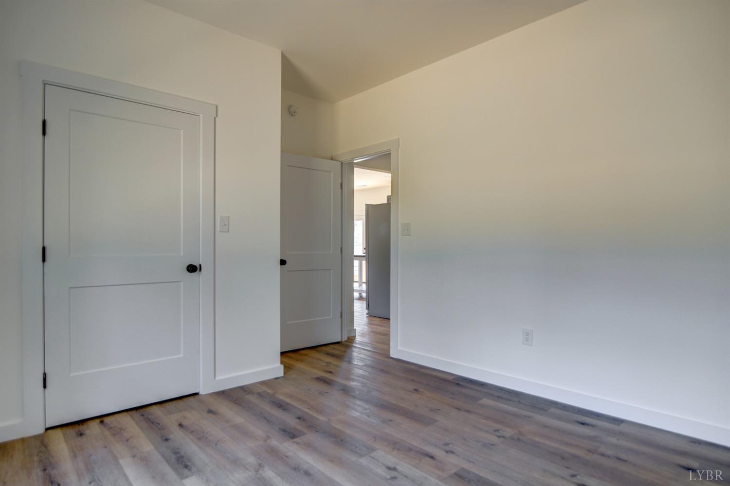 330 Bellview Road Appomattox, VA 24522 - Photo 24 of 26 a view of an empty room with wooden floor and closet