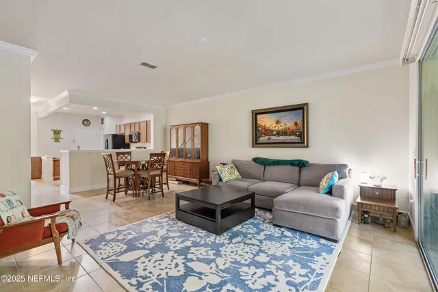 a living room with furniture and a rug