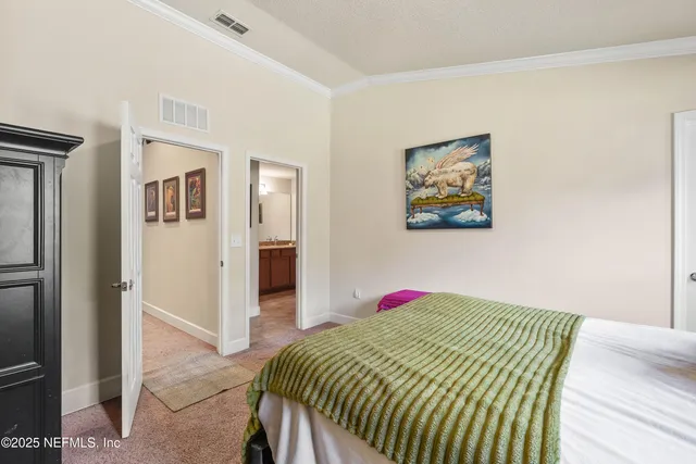 a bedroom with a bed and a cabinets