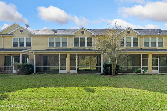 a front view of a building with a yard