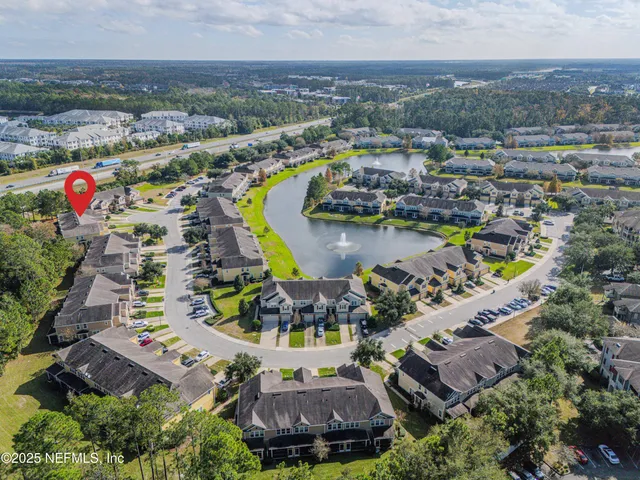 an aerial view of residential houses with outdoor space