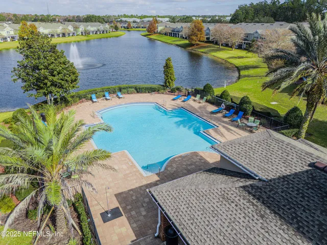 an aerial view of a house with outdoor space