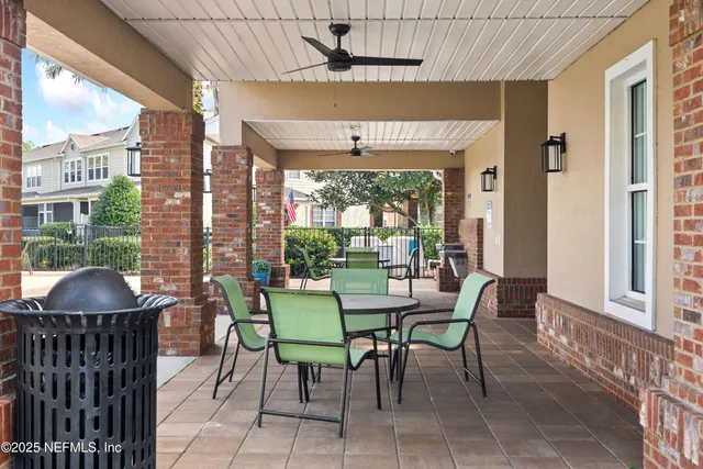 a dining room with furniture window and outside view